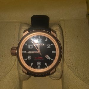 Invicta gold men’s strap watch.